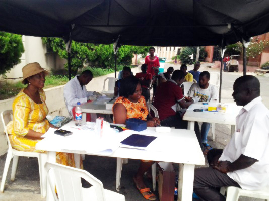 Checking the blood pressure in Ikeja, Lagos, Nigeria - Fadeke Olusanya Abuworonye