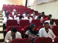 Participants of the morning session taking the test after the online course